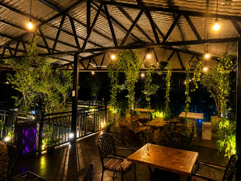 Rooftop restaurant at Hotel Rosenro with evening lighting and open-air dining atmosphere.